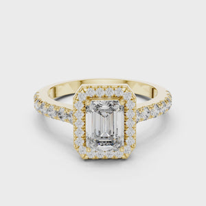 Video showcasing yellow gold emerald cut engagement ring with halo and pave band