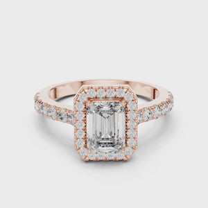 Video showcasing rose gold emerald cut engagement ring with halo and pave band