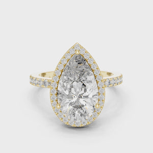 360-degree view of a pear-cut diamond halo engagement ring in yellow gold