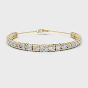 Video of yellow gold graduated round diamond tennis bracelet