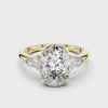 A video showcasing a luxury three-stone lab-grown diamond engagement ring in solid yellow gold, highlighting a brilliant 2.75 carat oval center diamond paired with two pear-cut side stones.