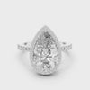 360-degree view of a pear-cut diamond halo engagement ring in white gold