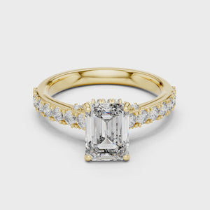 360-degree video showcase of a 1.67 CT emerald cut lab-grown diamond engagement ring with a pavé band in yellow gold