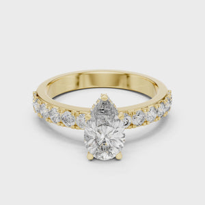 Video of a 1.10 CT pear cut lab grown diamond engagement ring with pave band in yellow gold