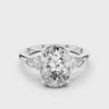 A video showcasing a luxury three-stone lab-grown diamond engagement ring in solid white gold, highlighting a brilliant 2.75 carat oval center diamond paired with two pear-cut side stones.