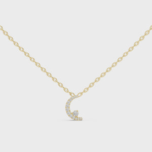 Yellow gold crescent moon pendant necklace video featuring graduated lab-grown diamonds.