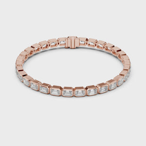 Video of the emerald cut lab grown diamond eternity tennis bracelet, showing light across every stone
