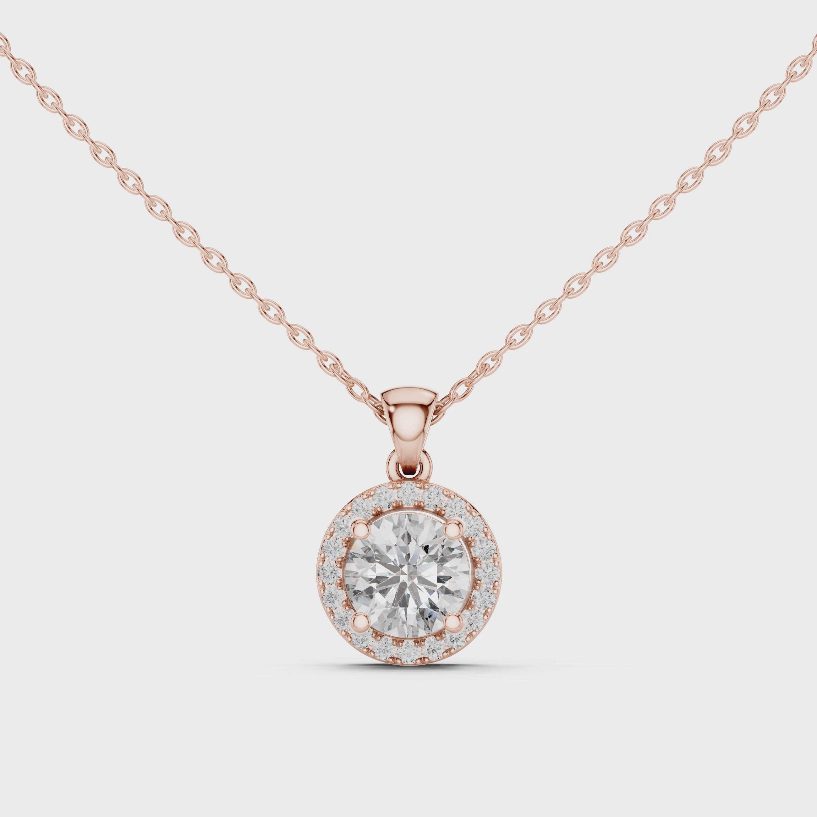 Video of rose gold round solitaire lab-grown diamond halo pendant
