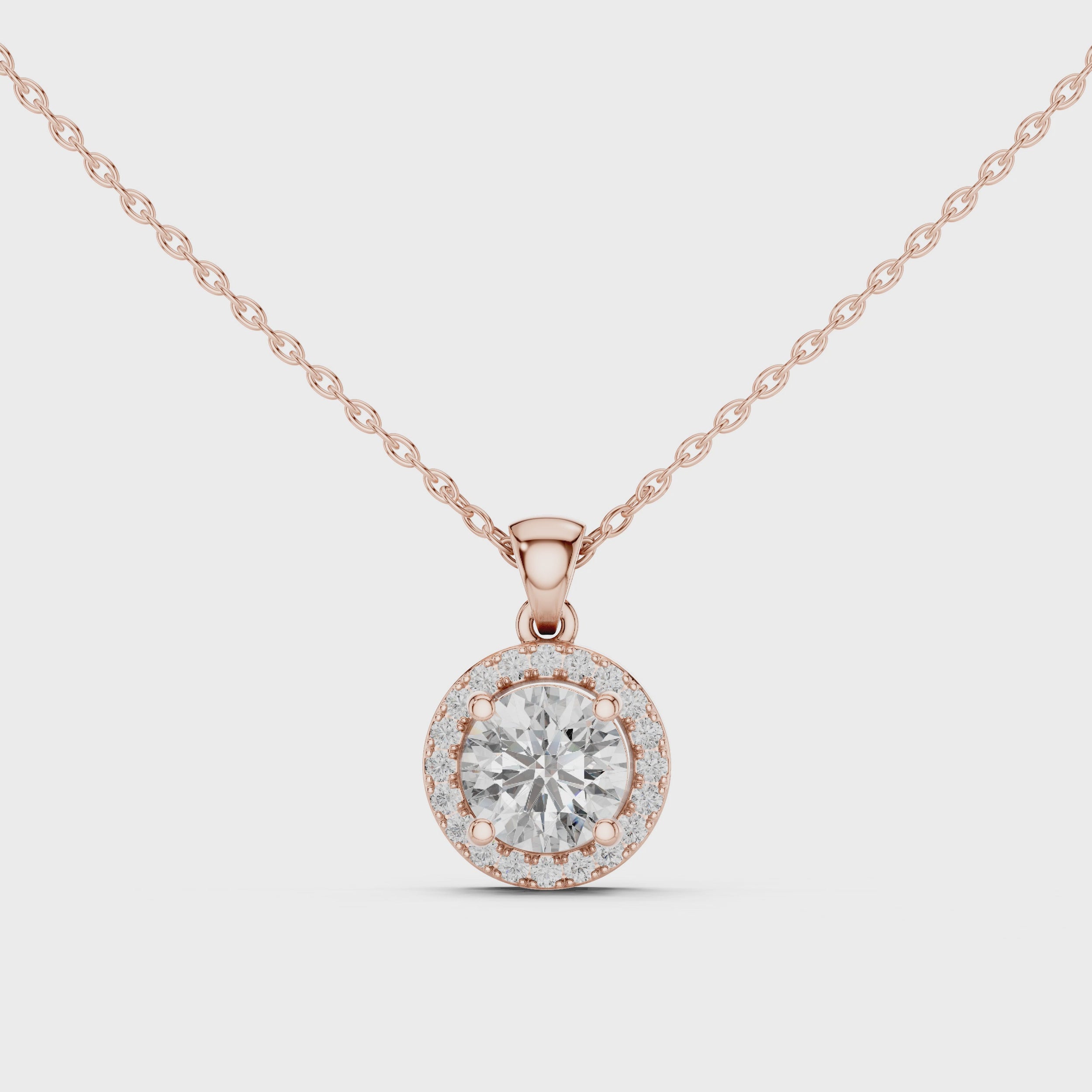 Video of rose gold round solitaire lab-grown diamond halo pendant