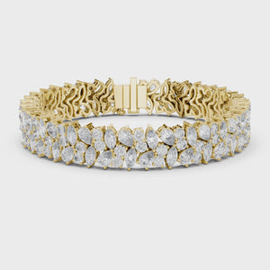 Video of yellow gold marquise and pear diamond cluster bracelet