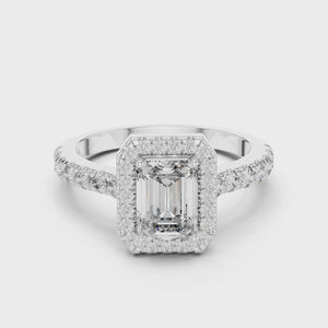 Video showcasing white gold emerald cut engagement ring with halo and pave band