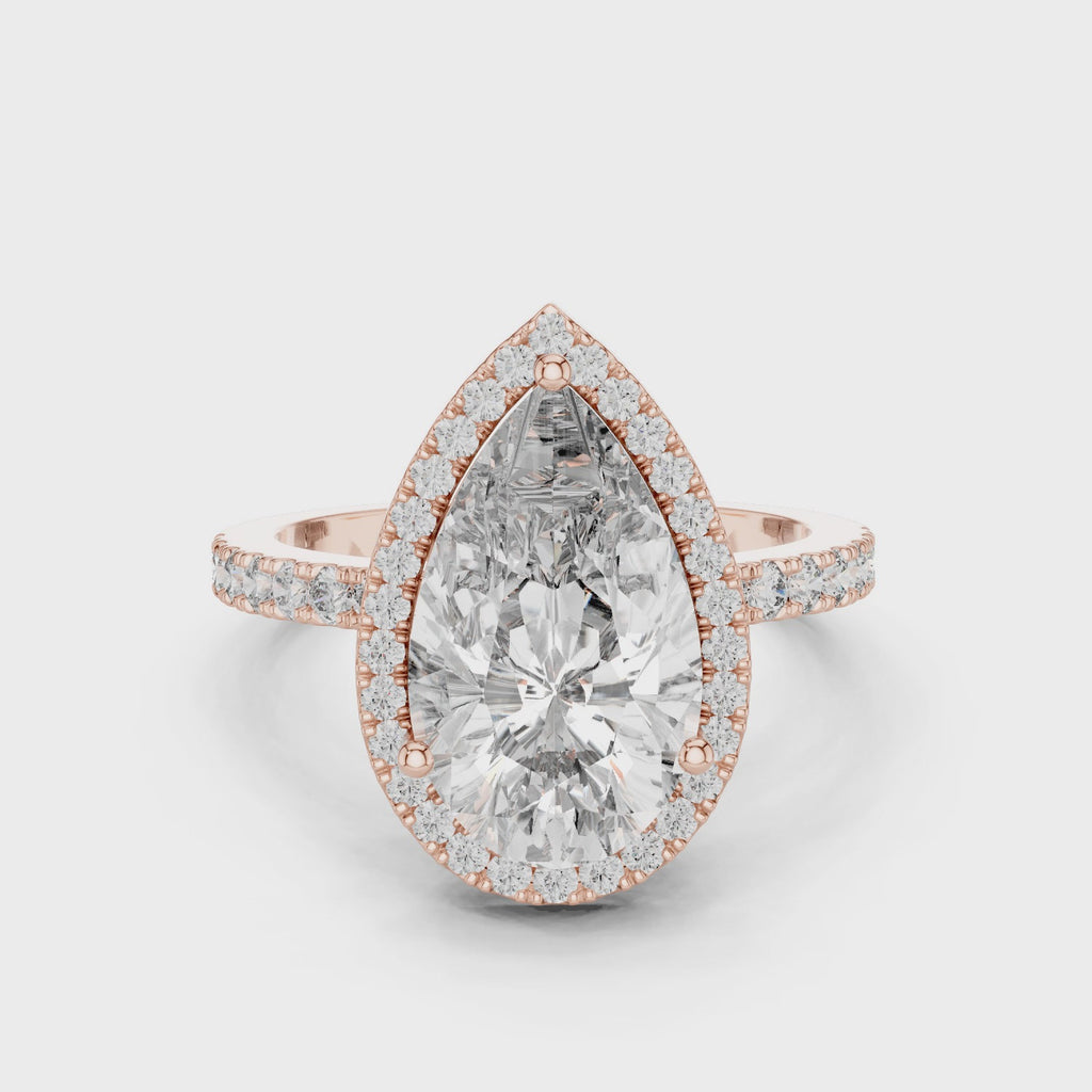 360-degree view of a pear-cut diamond halo engagement ring in rose gold