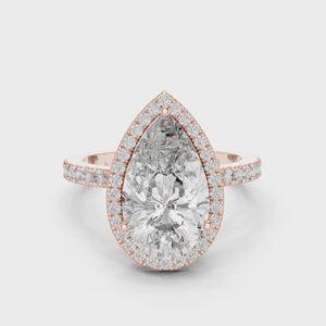 360-degree view of a pear-cut diamond halo engagement ring in rose gold