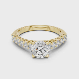 360-degree product video of a yellow gold round cut lab-grown diamond engagement ring with side stones