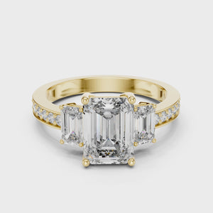 360 degree video of yellow gold three-stone emerald cut diamond ring