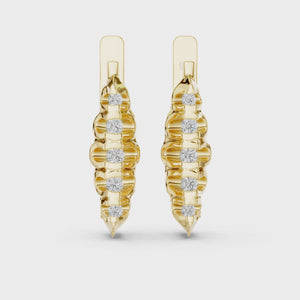 Video of yellow gold lab grown diamond graduated bezel huggie earrings