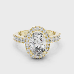 1.60 CT oval cut lab grown diamond yellow gold halo engagement ring video preview with pavé side stones on a white background.
