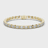 Video of yellow gold emerald cut bezel set diamond tennis bracelet