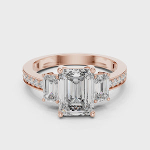 360 degree video of rose gold three-stone emerald cut diamond ring