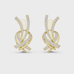 Video of yellow gold lab grown diamond love knot huggie earrings